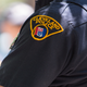 A Cleveland police officer looks on as people take to the streets to protest May 23, 2015, after Cleveland Police Officer Michael Brelo was acquitted of manslaughter charges after he shot two people in a 2012 car chase in which officers fired a total of 137 shots.
Ricky Rhodes/Getty Images